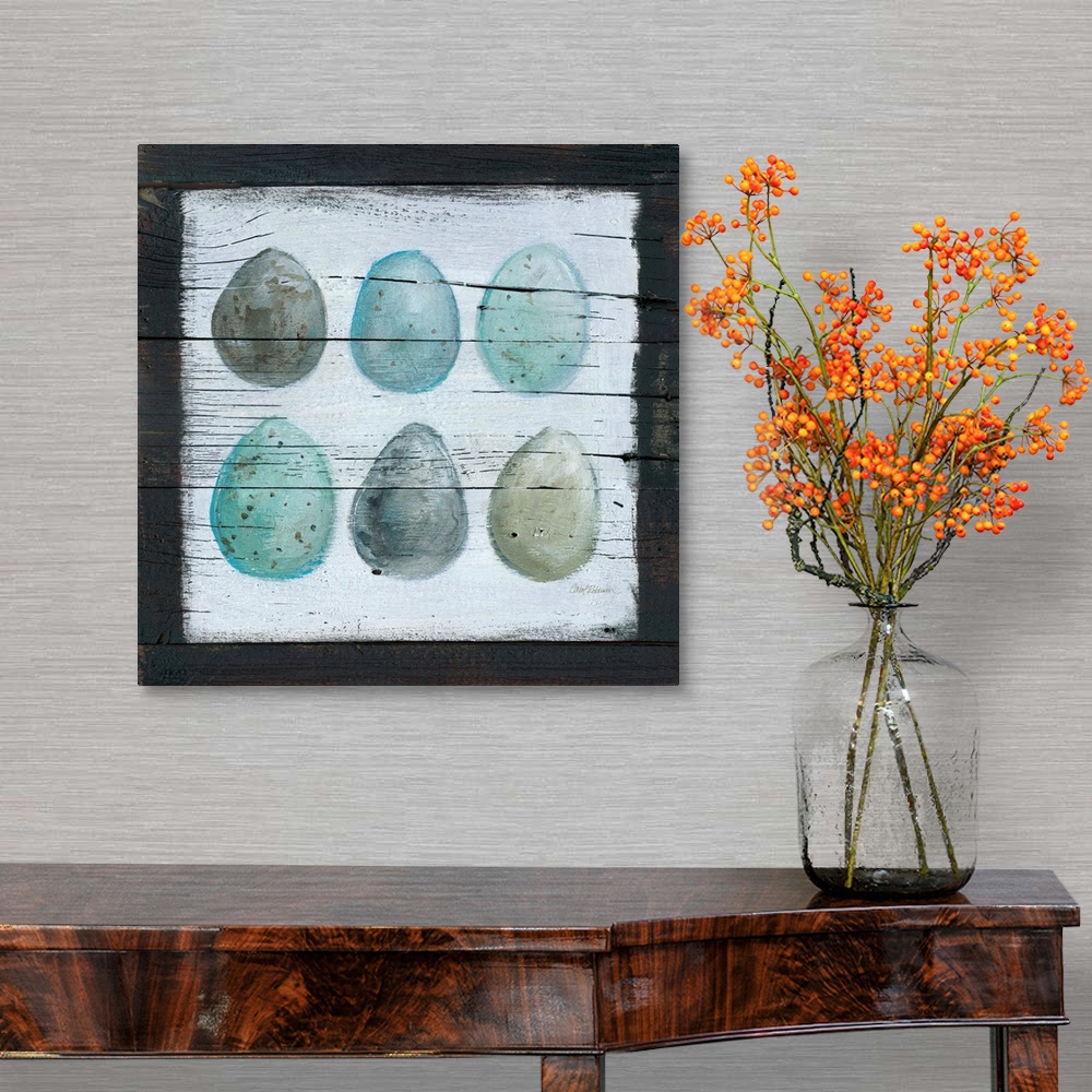 A traditional room featuring A wooden painting of six eggs using cool tones.