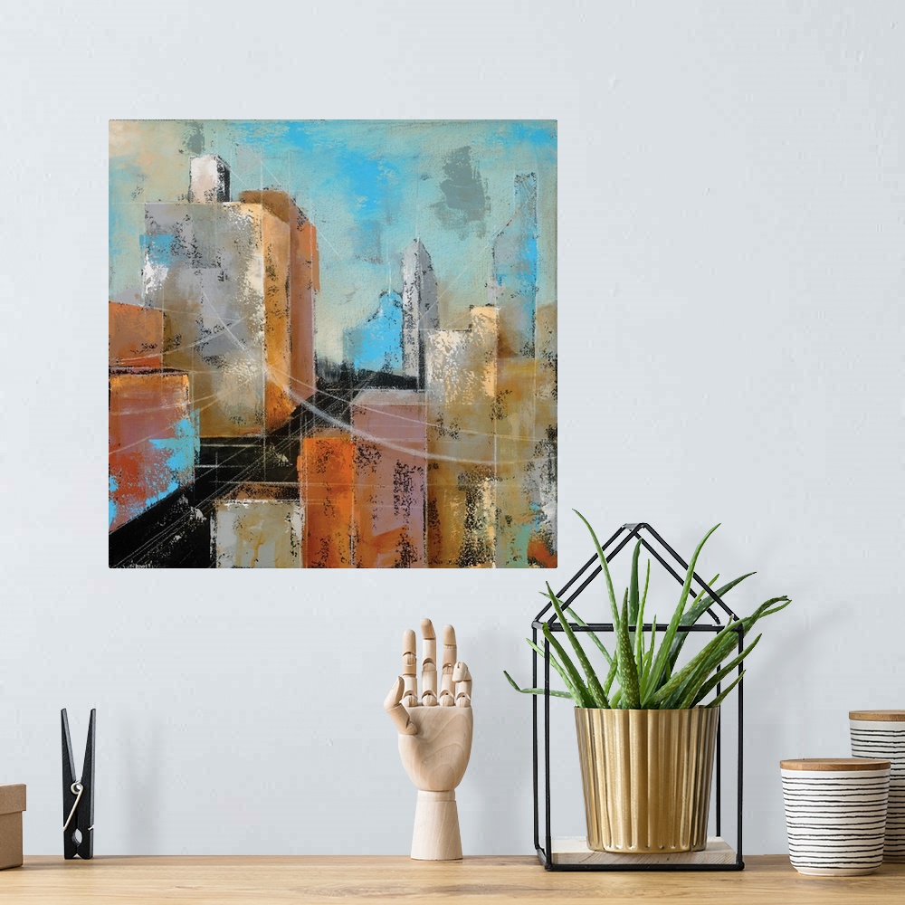 A bohemian room featuring Square abstract painting of a streetscape using red, orange, yellow, and blue hues.