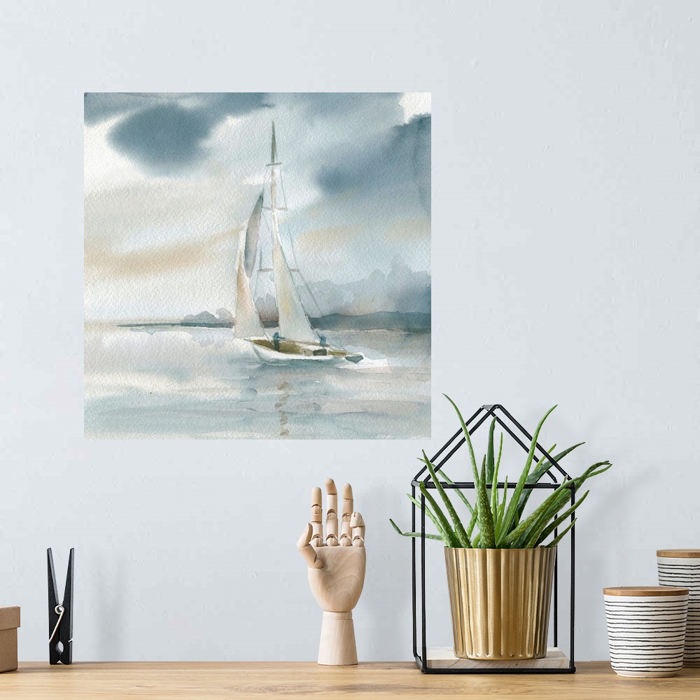 A bohemian room featuring Square watercolor painting of a sailboat on the ocean in shades of blue and beige.
