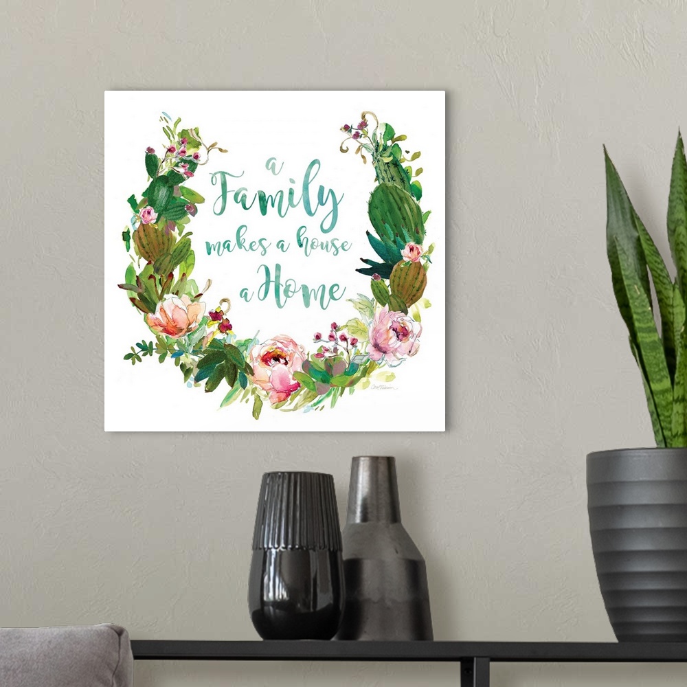 A modern room featuring Square watercolor painting with a wreath made out of flowers and succulents and the phrase "A Fam...