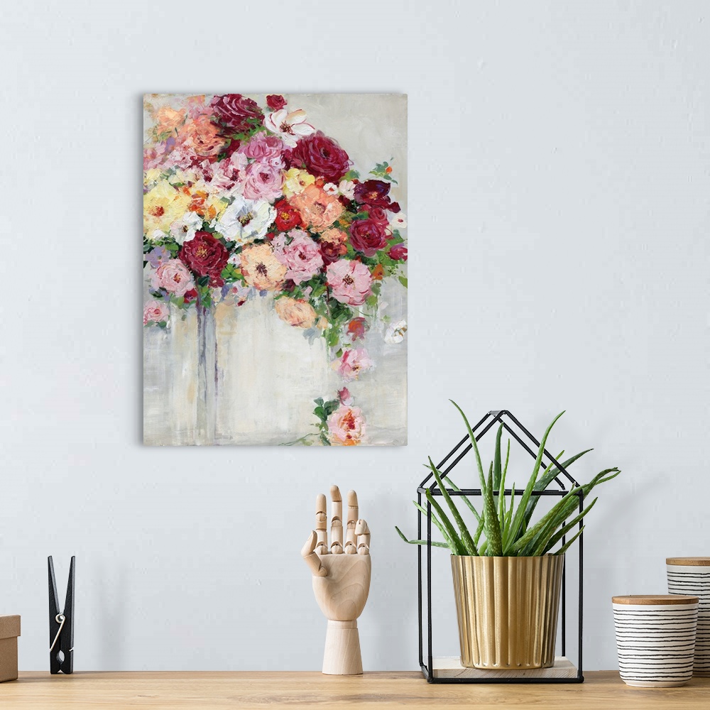 A bohemian room featuring Vertical painting of a colorful flower arrangement on a gray toned background.