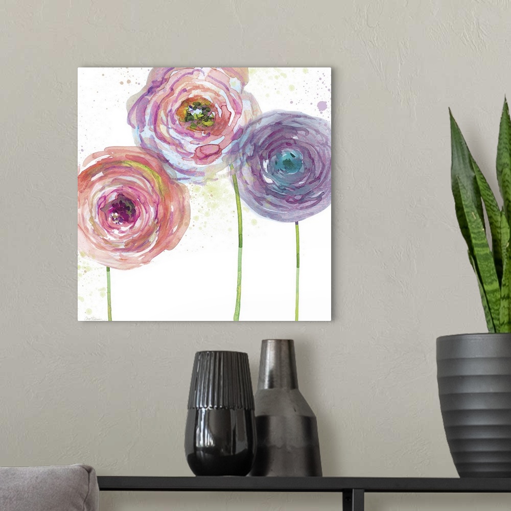 A modern room featuring A watercolor painting of three pink, purple, and blue toned flowers.