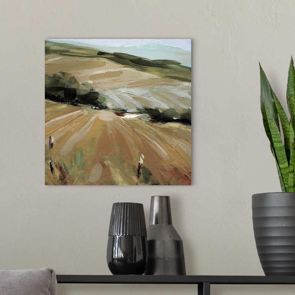 A modern room featuring A painting of a pasture in the summer with green foliage created from broad brushstrokes.
