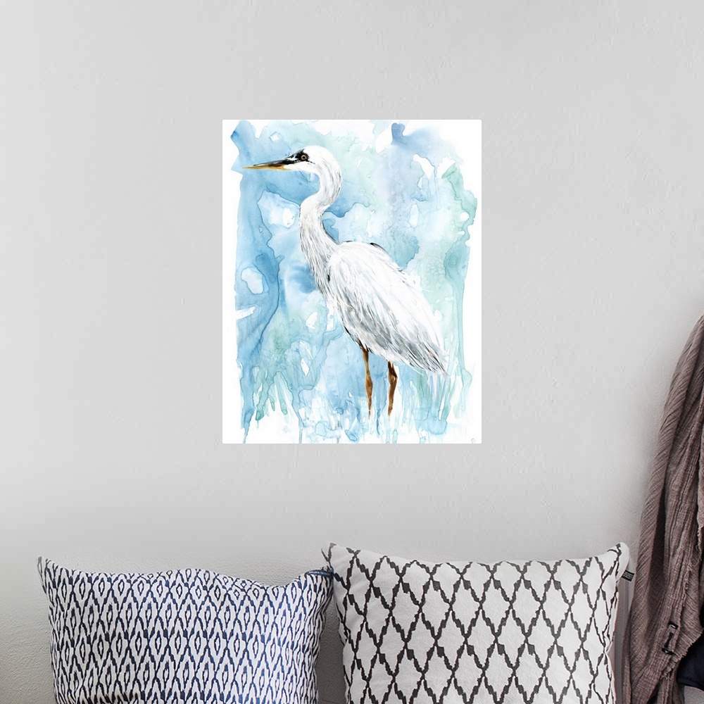 A bohemian room featuring Watercolor painting of a white Egret on a blue background.