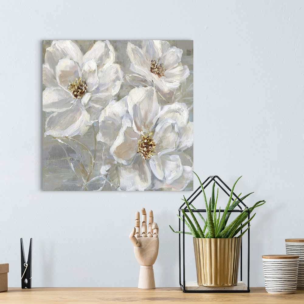 A bohemian room featuring Square contemporary painting of three white flowers on a neutral colored background with light hi...