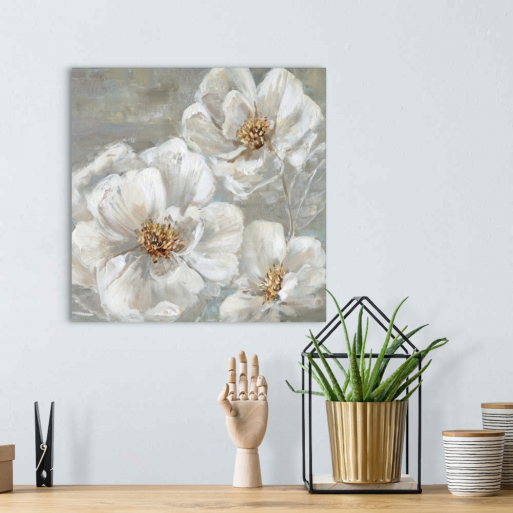 A bohemian room featuring Square contemporary painting of three white flowers on a neutral colored background with light hi...