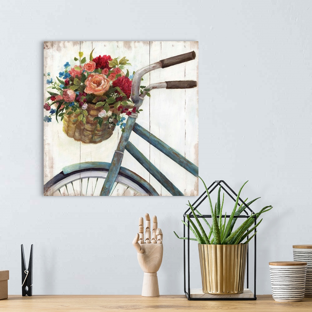 A bohemian room featuring Square decor with a painted blue bicycle with a basket filled with freshly picked flowers, on a d...