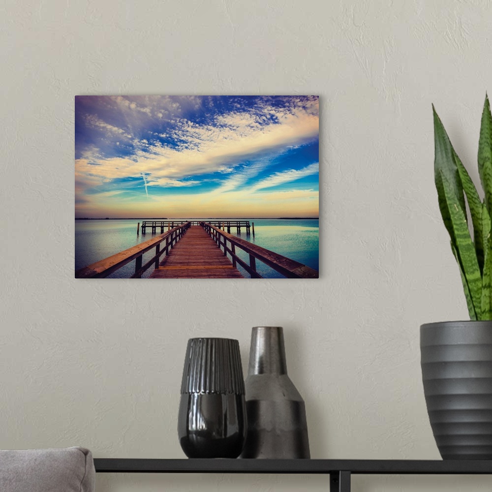 A modern room featuring Photograph of a pier at sunrise with beautiful clouds.