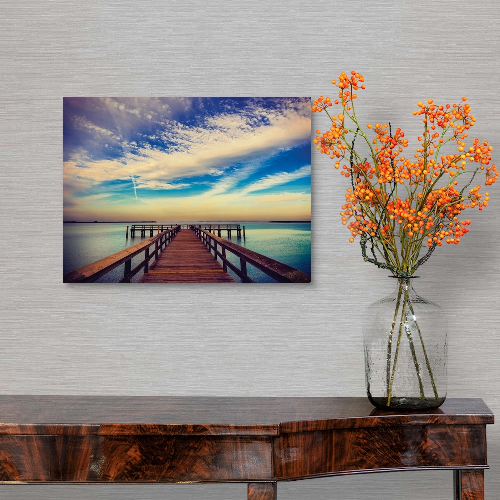 A traditional room featuring Photograph of a pier at sunrise with beautiful clouds.