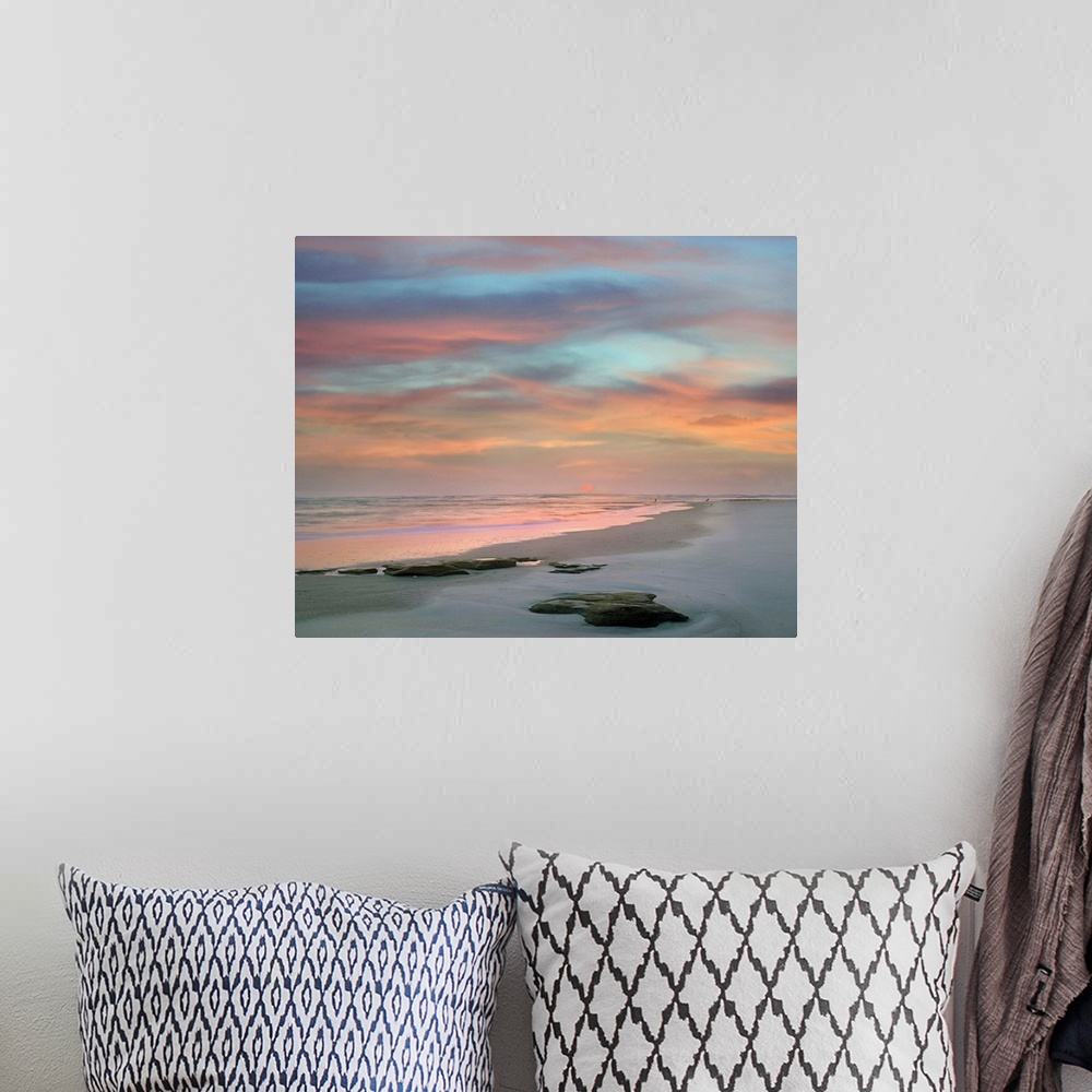 A bohemian room featuring Landscape photograph of a colorful sunset on Matanzas Beach, FL.