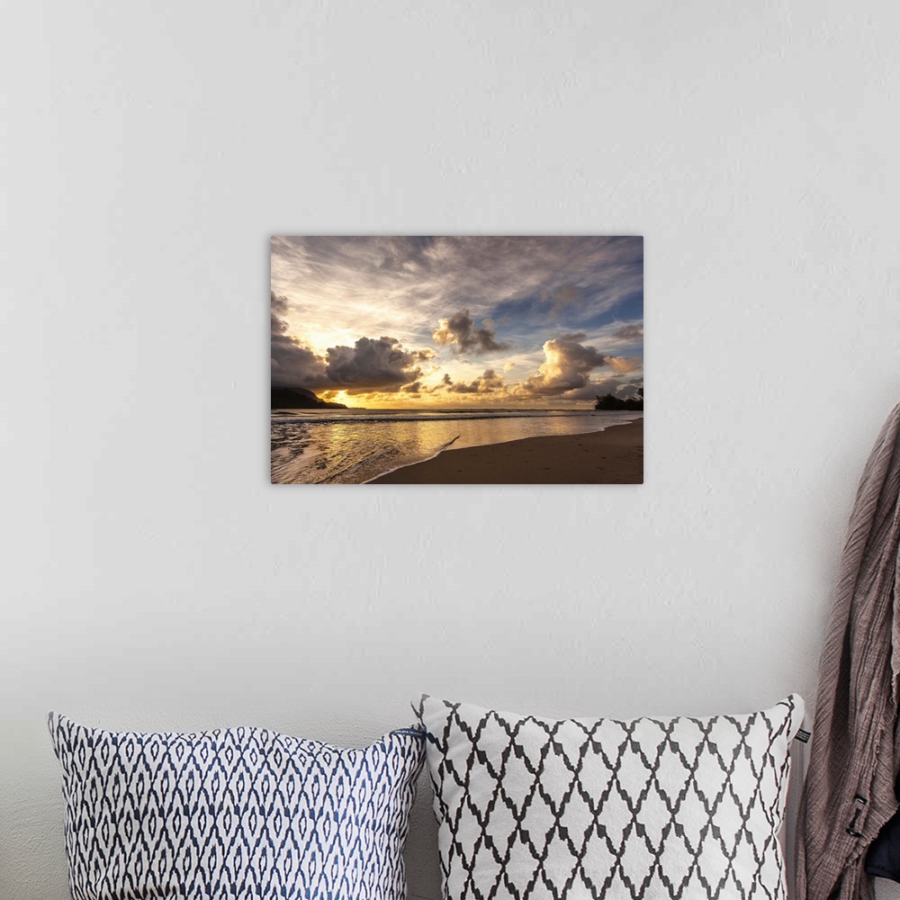 A bohemian room featuring A photograph of a sunset in Hanalei Bay, Hawaii.