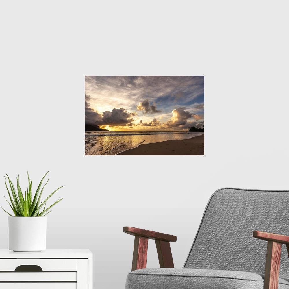 A modern room featuring A photograph of a sunset in Hanalei Bay, Hawaii.