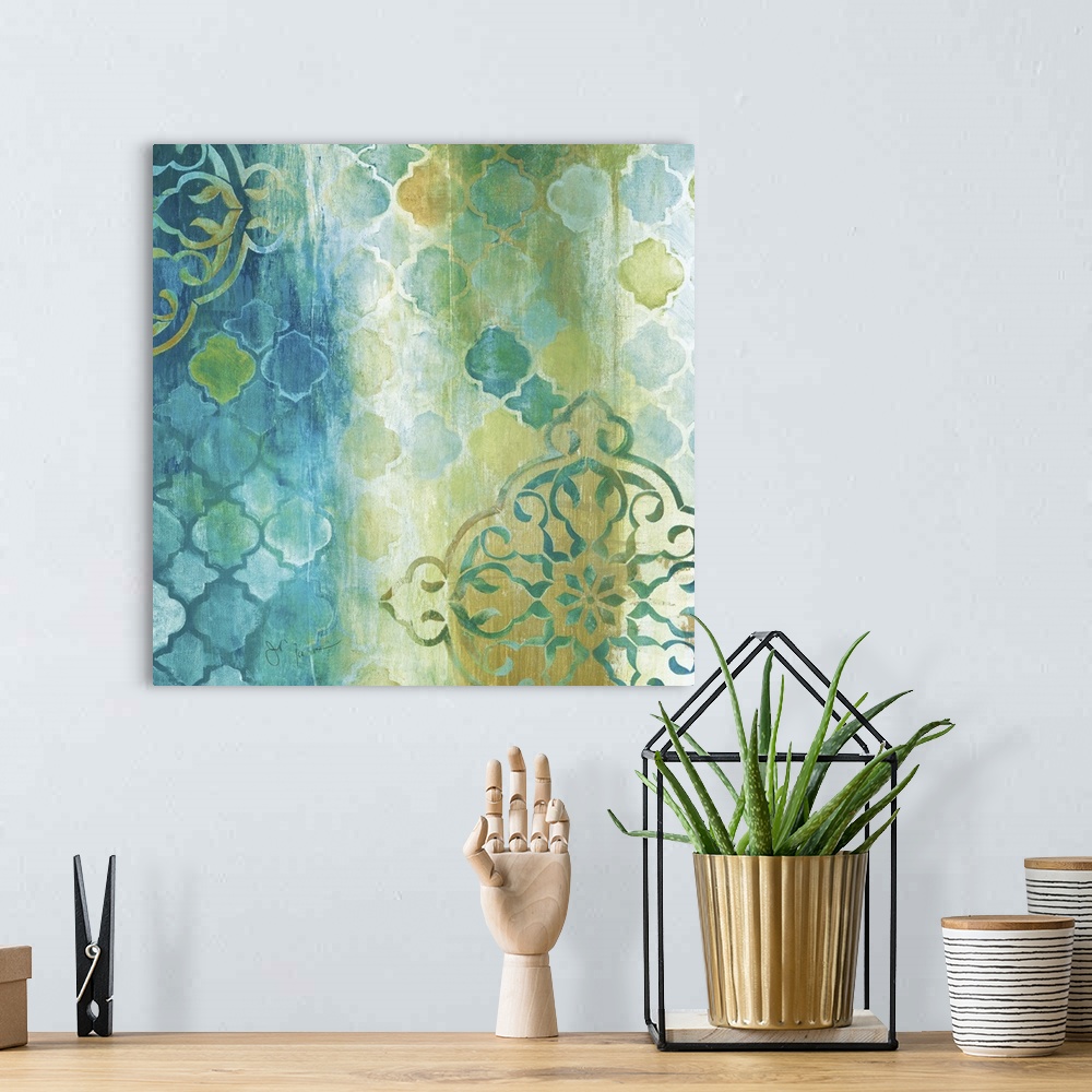 A bohemian room featuring Square painting in teal, gold, green, and white with a patterned print.