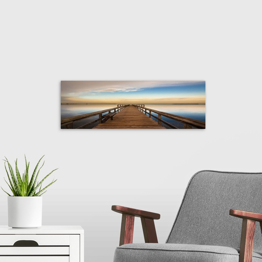 A modern room featuring Photograph of a long, wooden pier over the Terra Ceia Bay in Florida with a golden sunset.