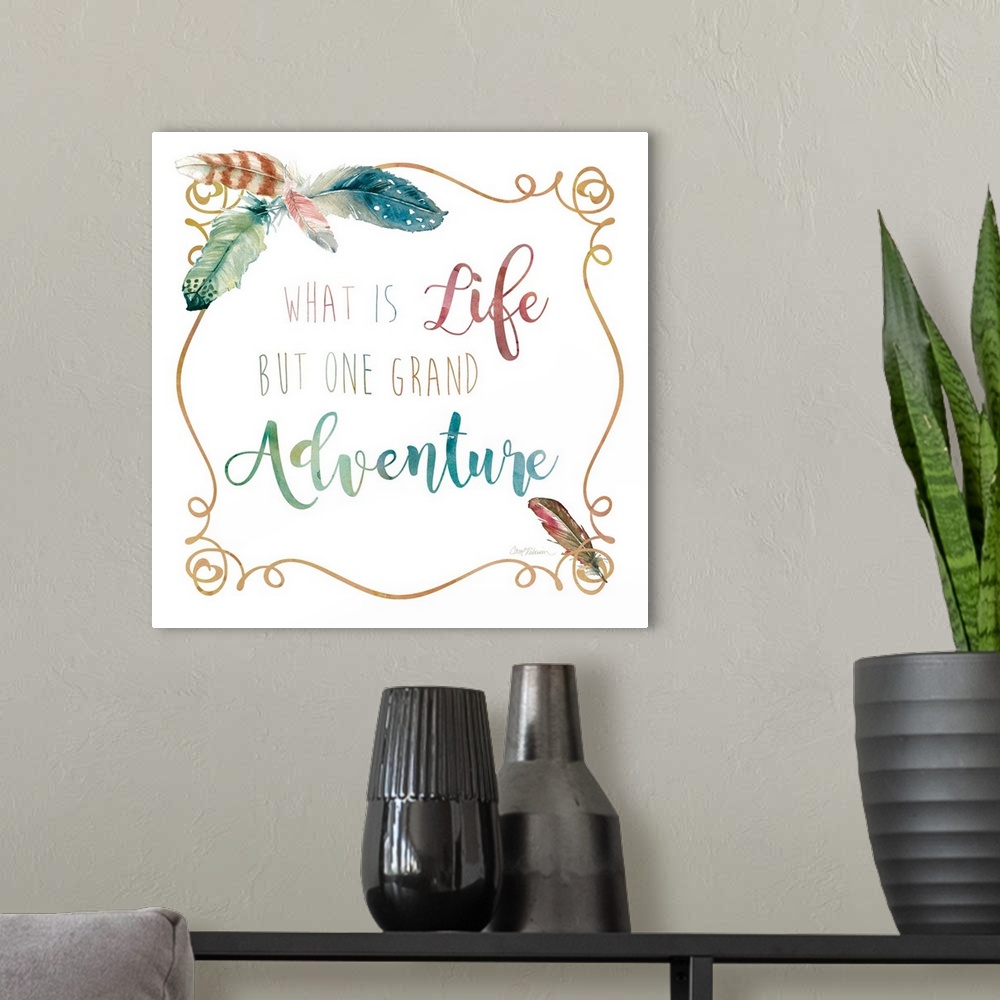 A modern room featuring "What Is Life But One Grand Adventure" framed with watercolor feathers on the corners.