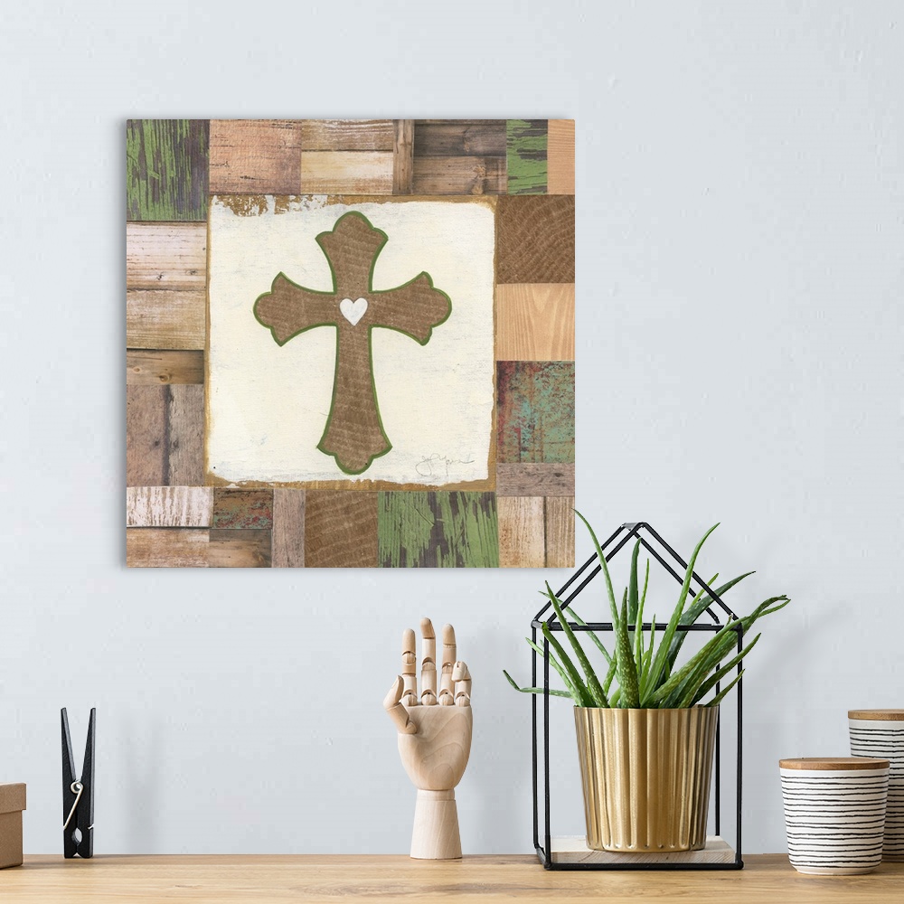 A bohemian room featuring A decorative painting of a wooden cross outlined in green with a white heart in the middle painte...