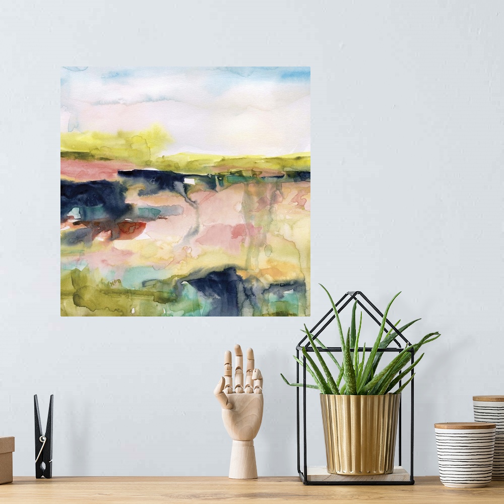 A bohemian room featuring A square watercolor abstract painting with bold and bright colors blending together.