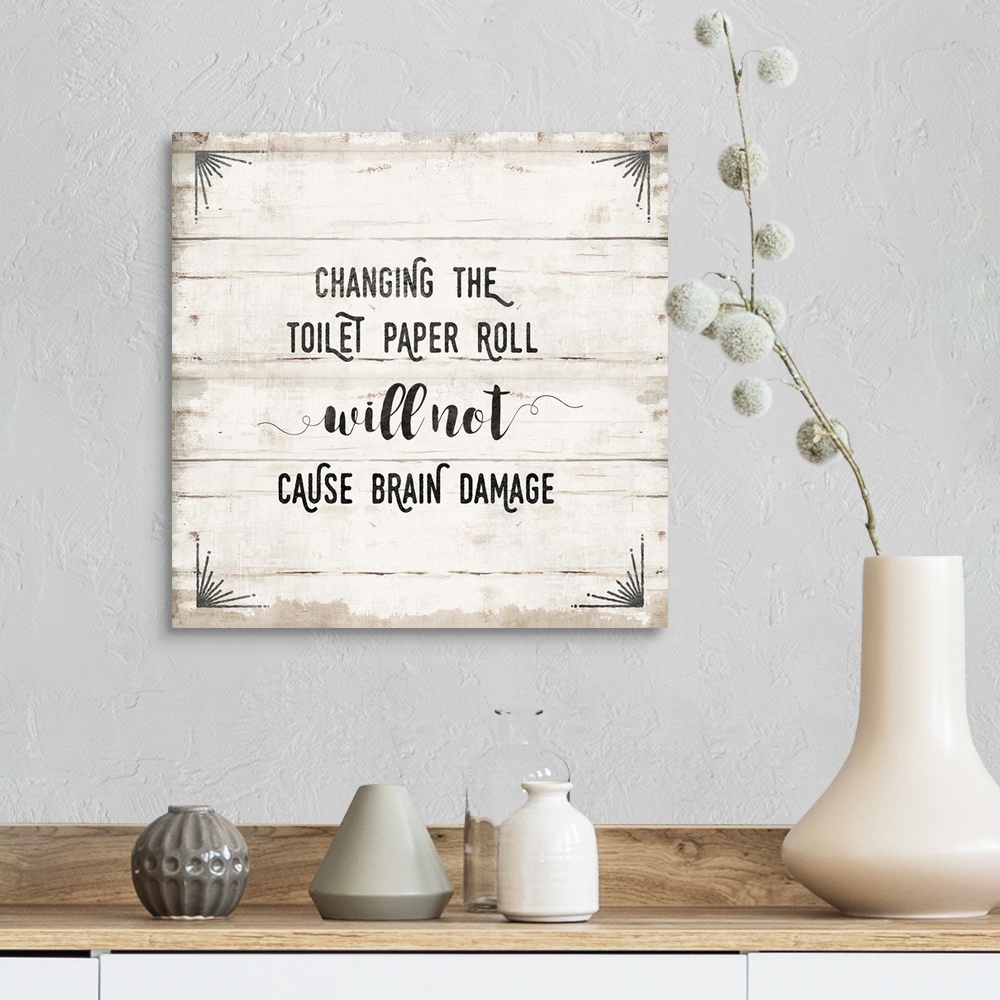 A farmhouse room featuring "Changing the toilet paper roll will not cause brain damage" text is playfully placed on a horizo...