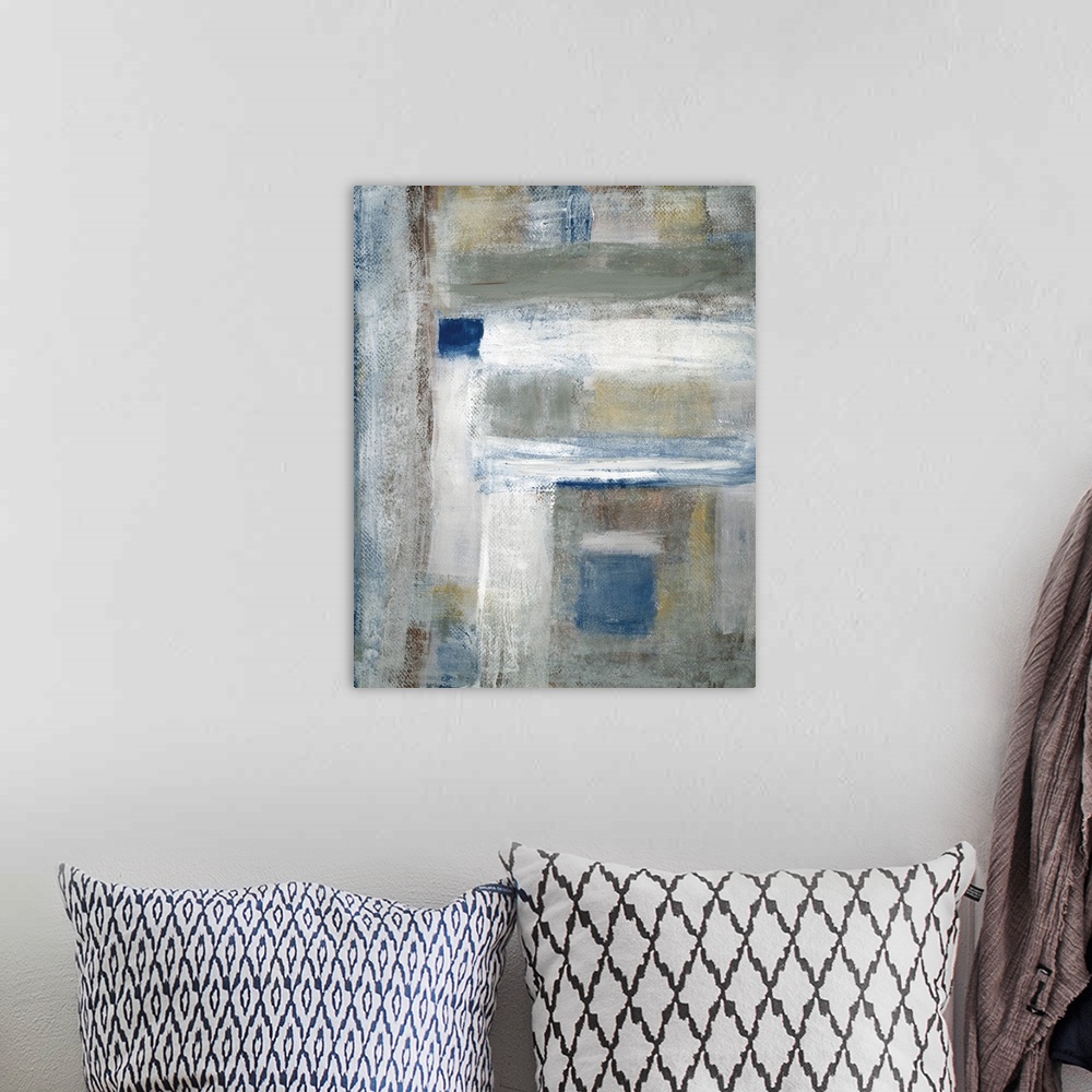 A bohemian room featuring Abstract painting of perpendicular brush strokes in colors of blue, white and gray.