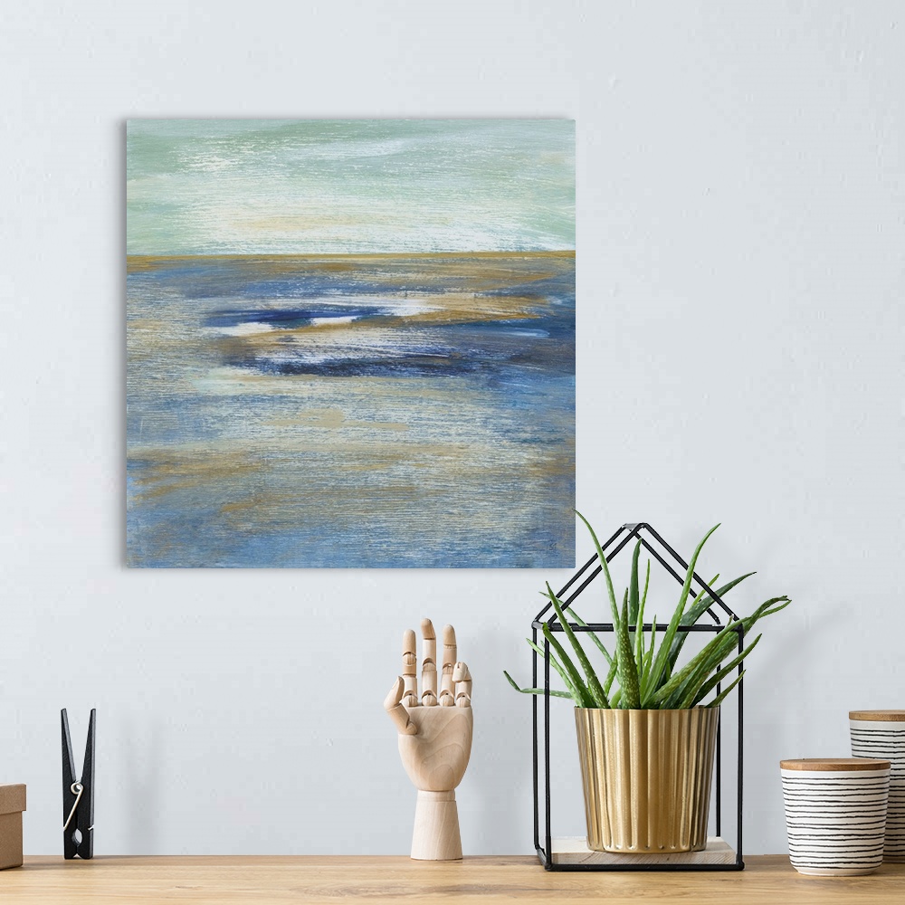 A bohemian room featuring This square abstract painting of blue, white and gold horizontal brush strokes depicts the artist...