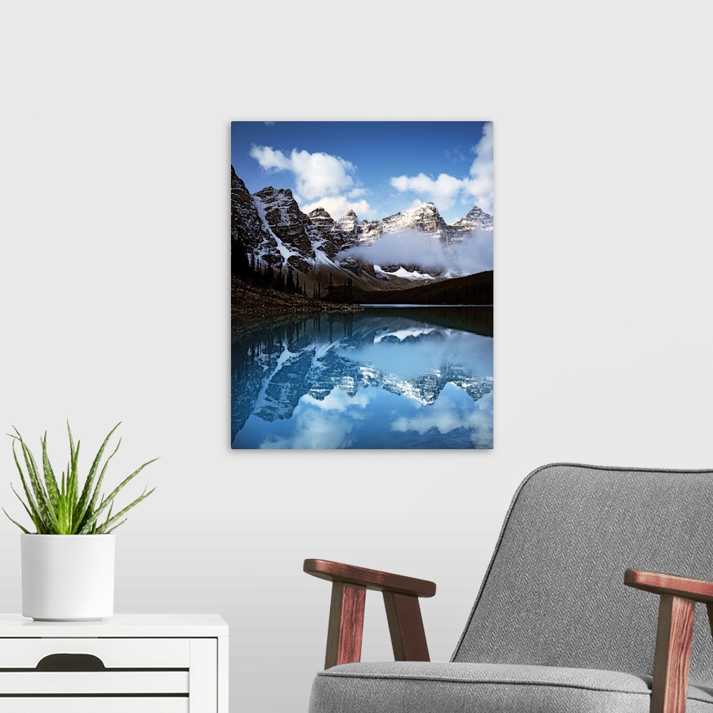 A modern room featuring Moraine Lake surrounded by snow-capped mountains in Banff National Park, Alberta, Canada.