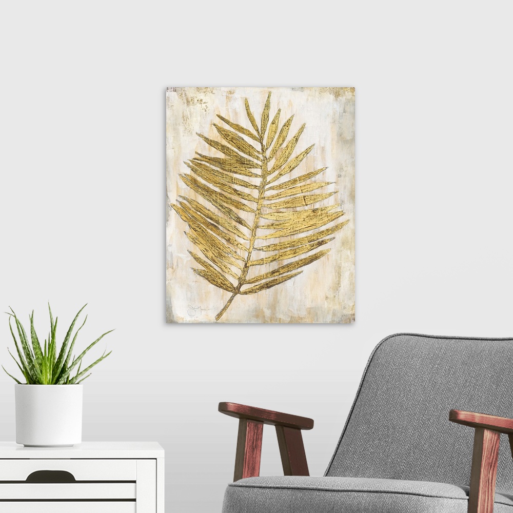 A modern room featuring Gold and cream decor with a palm branch that has thin leaves,