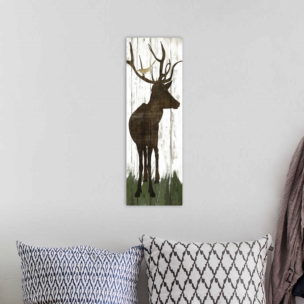 A bohemian room featuring Silhouette of a deer with birds in its antlers on a wooden board background.