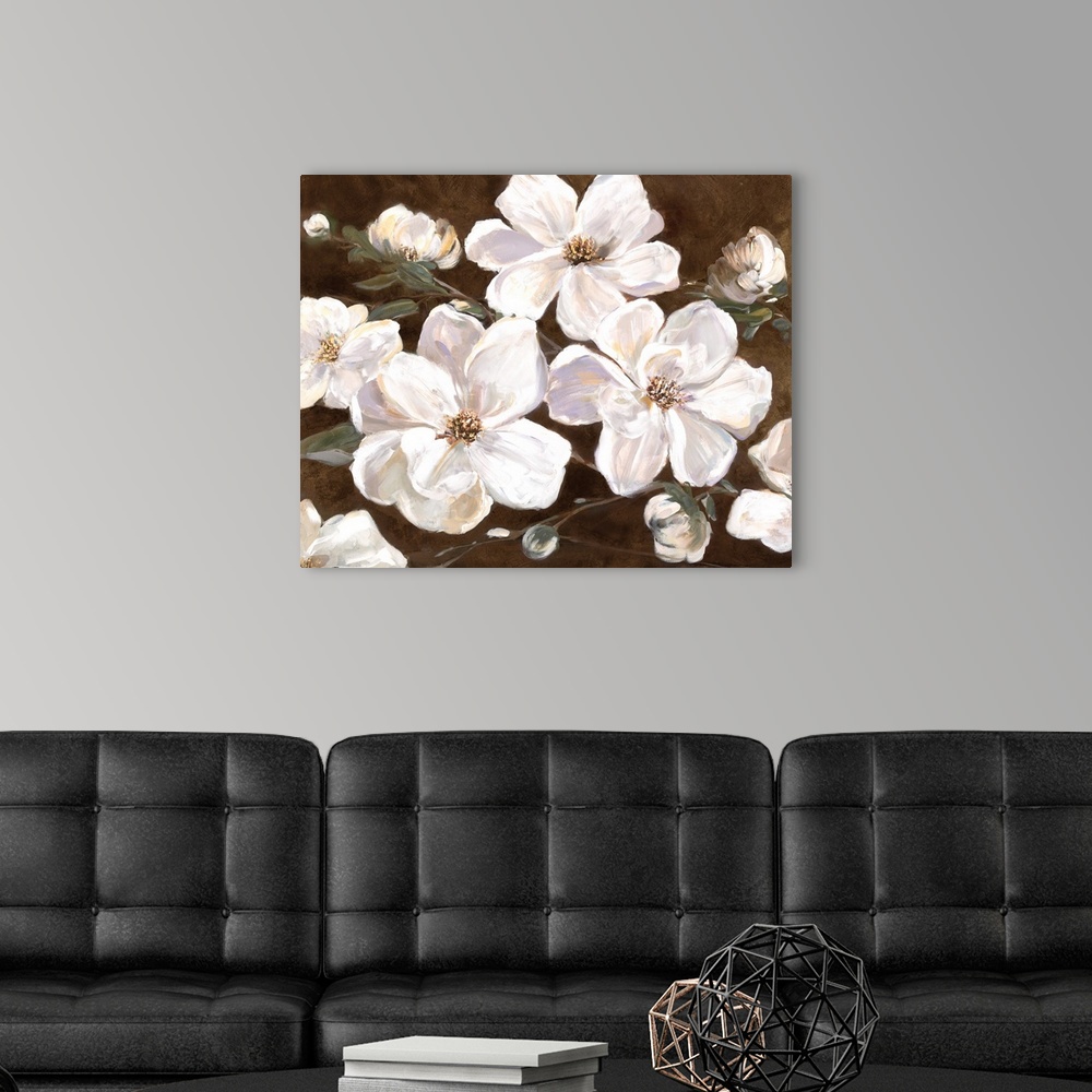 A modern room featuring Contemporary painting of large white flowers with broad petals on a rich brown background.