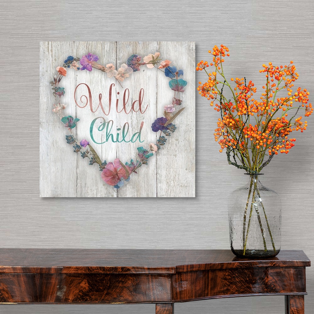 A traditional room featuring "Wild Child" placed on a white washed wood texture with dried flowers surrounding it.