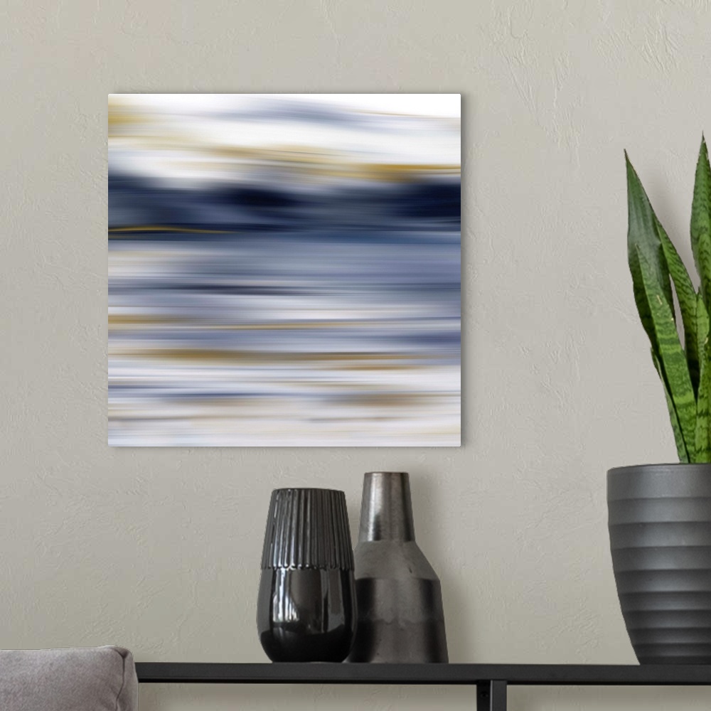 A modern room featuring Square abstract painting consisting of smooth fluid brush strokes that have been edited for a blu...