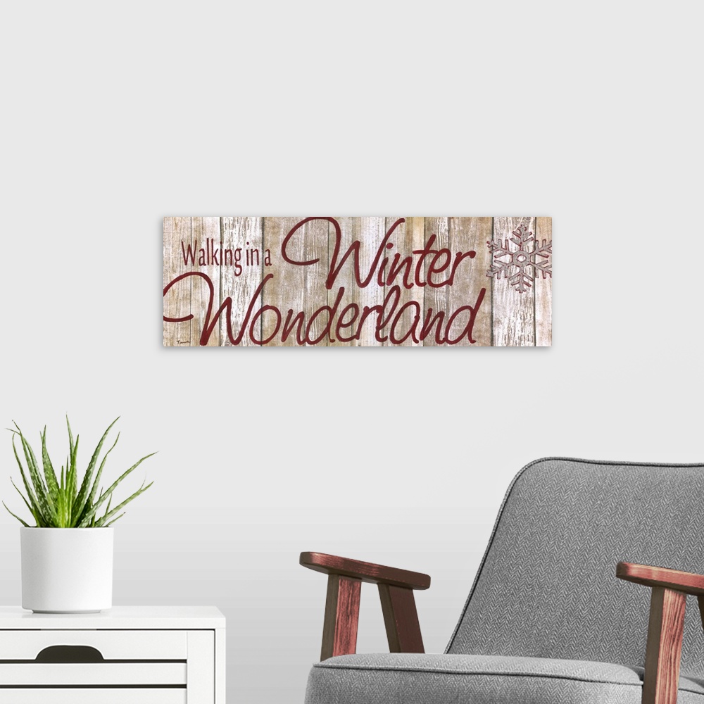 A modern room featuring ?Walking in a Winter Wonderland? painted in red with a silver and red snowflake on a wood backgro...