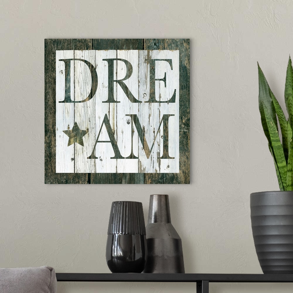 A modern room featuring Decorative artwork of a white square and the word 'Dream' in it against of rustic wood background.