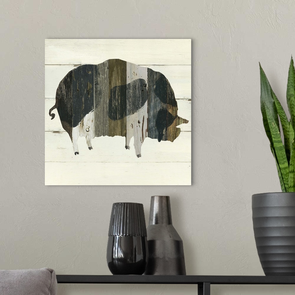 A modern room featuring A painting of a pig using multicolored stained wood placed on a white wooden background.