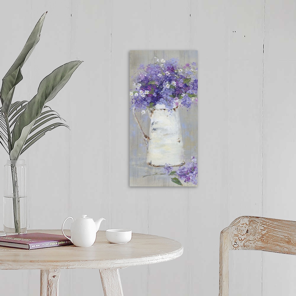 A farmhouse room featuring A contemporary still life painting of a bouquet of purple and pink flowers arranged in a white pi...