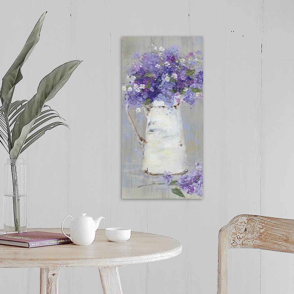 A farmhouse room featuring A contemporary still life painting of a bouquet of purple and pink flowers arranged in a white pi...