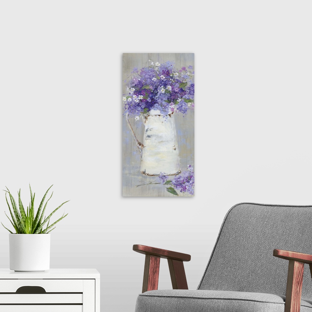 A modern room featuring A contemporary still life painting of a bouquet of purple and pink flowers arranged in a white pi...