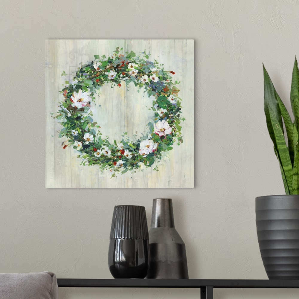 A modern room featuring A contemporary painting of a green wreath covered in white and red flowers on a wood background.