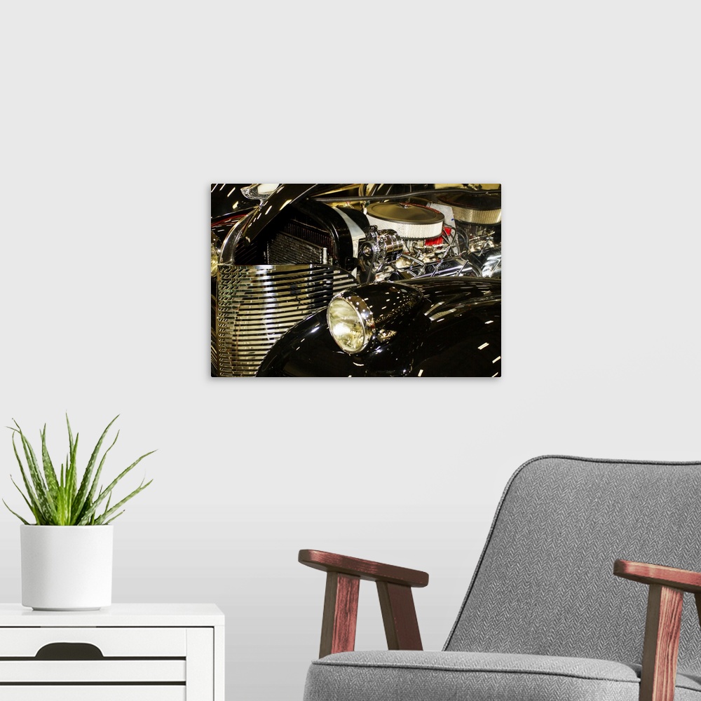 A modern room featuring Fine art photograph of the engine and grill of a vintage car.