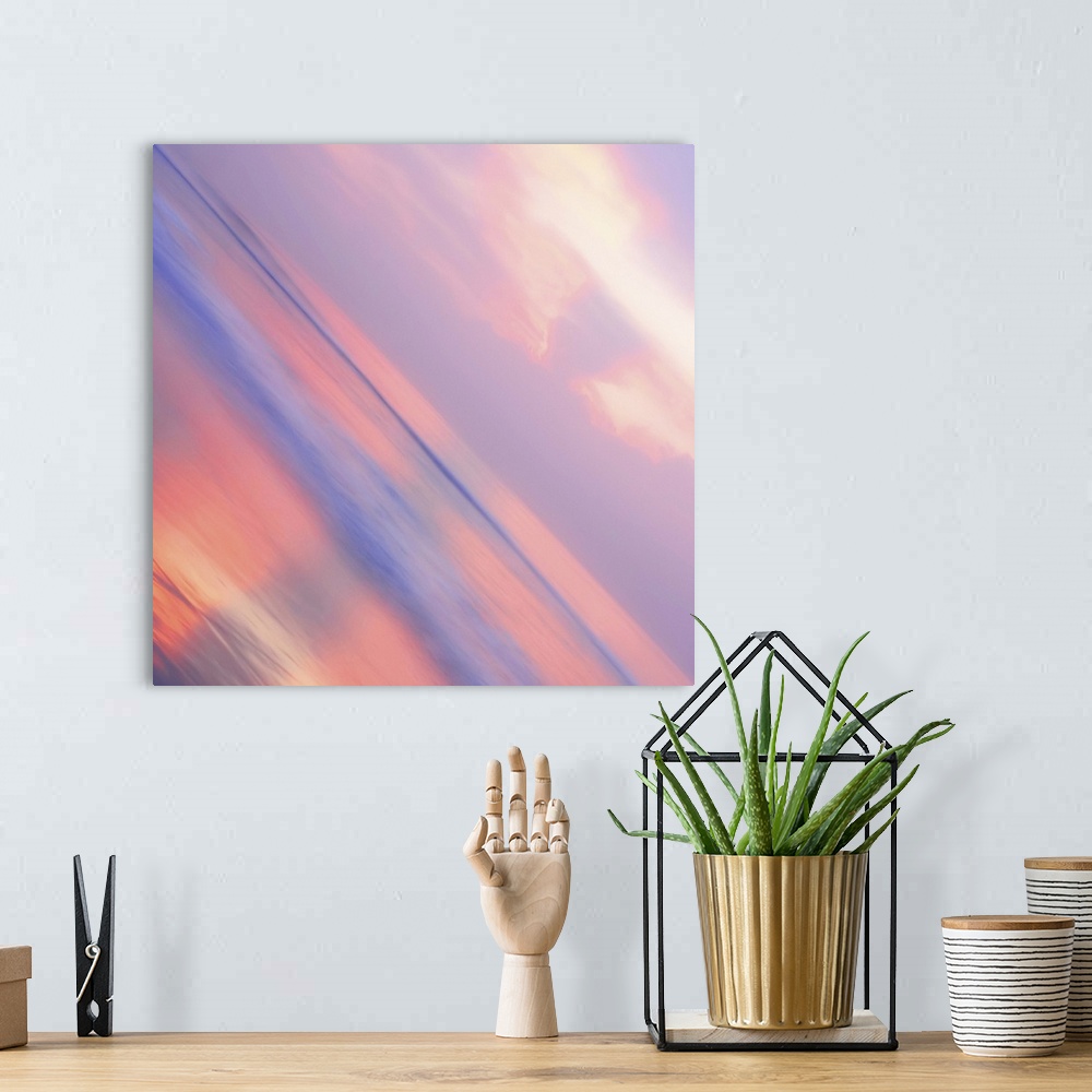 A bohemian room featuring A pastel-colored sky at sundown seen at a sharp angle, creating an abstract image.