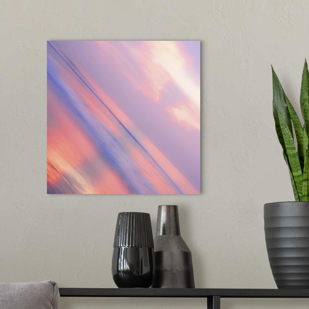 A modern room featuring A pastel-colored sky at sundown seen at a sharp angle, creating an abstract image.