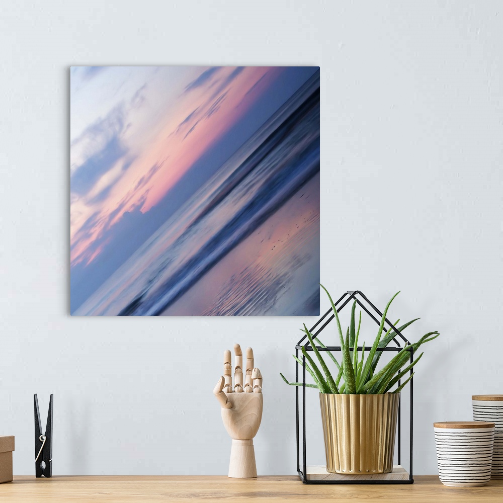 A bohemian room featuring A pastel-colored sky at sundown seen at a sharp angle, creating an abstract image.