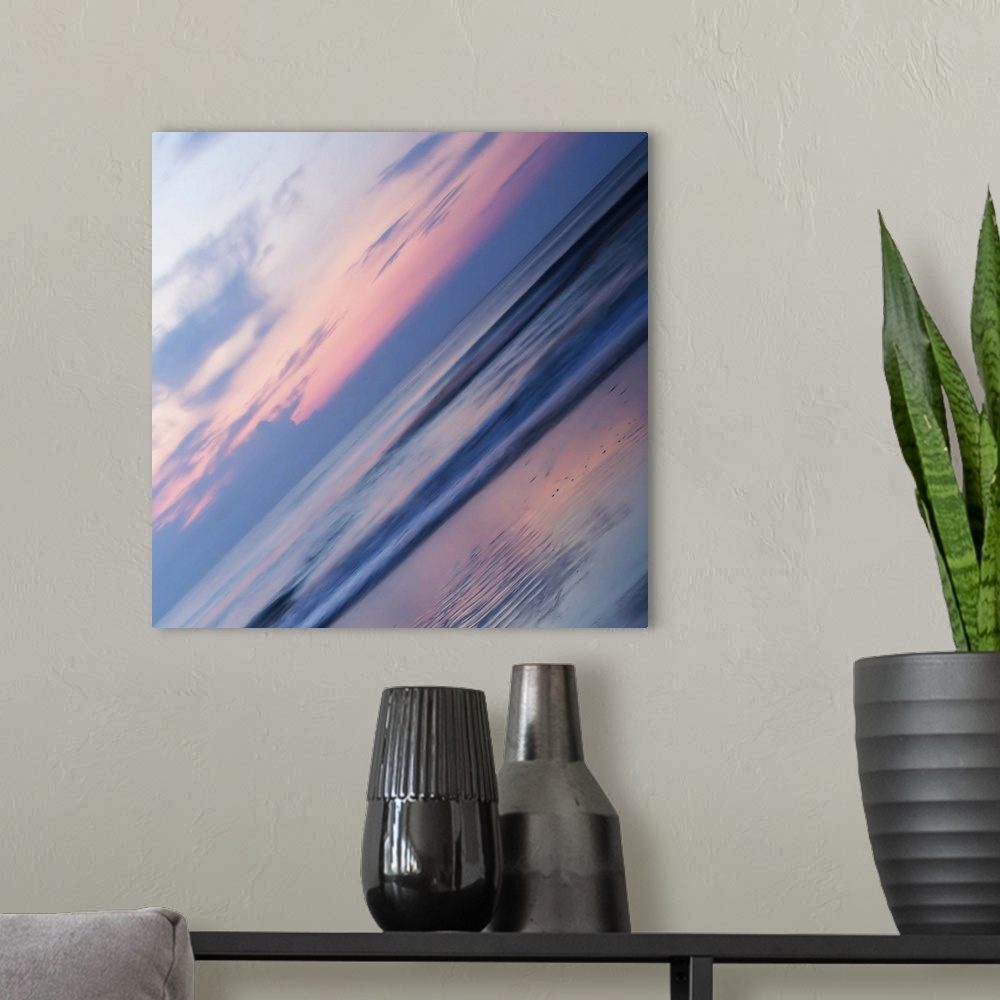 A modern room featuring A pastel-colored sky at sundown seen at a sharp angle, creating an abstract image.