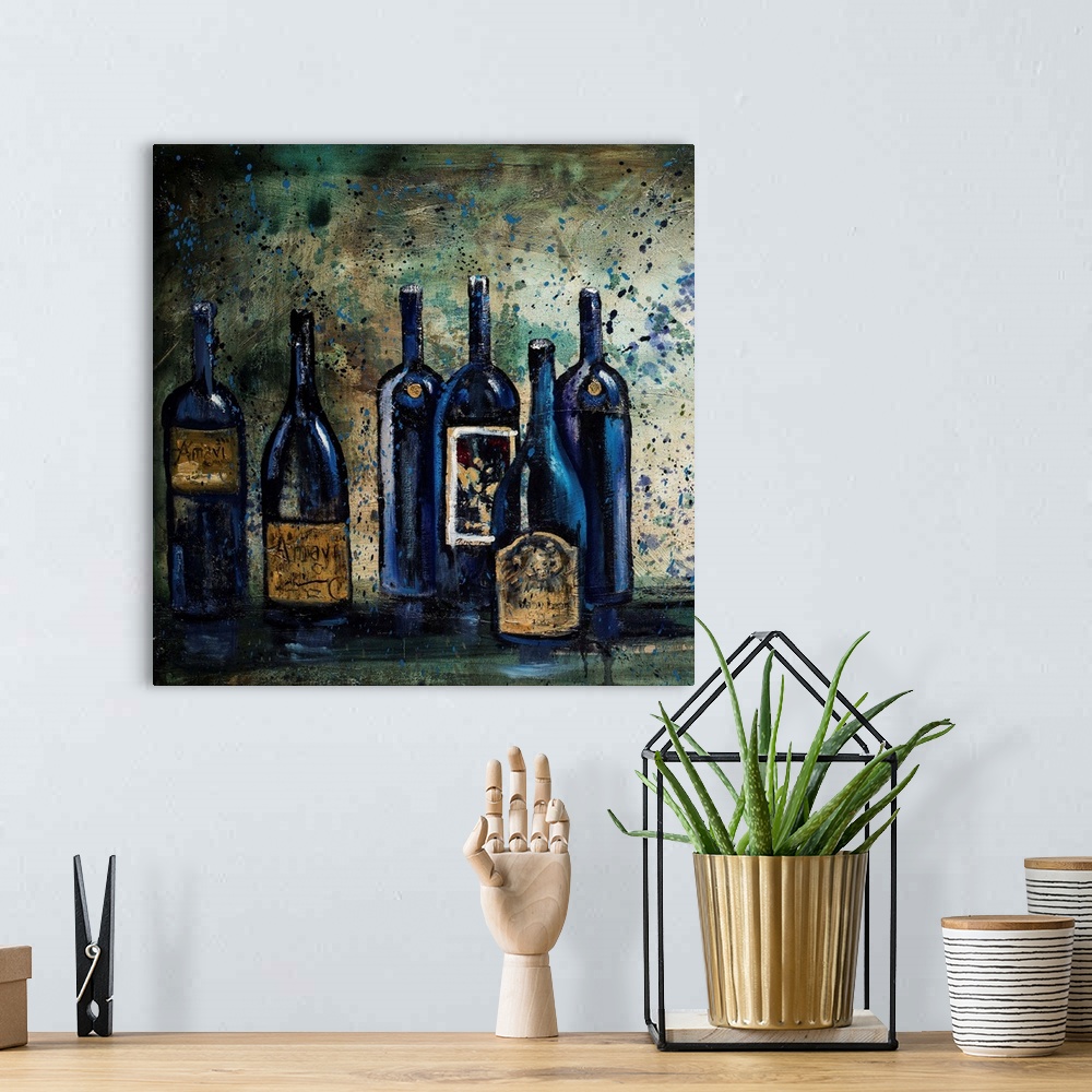 A bohemian room featuring Square still life painting of blue wine bottles on a table with a paint splattered background.