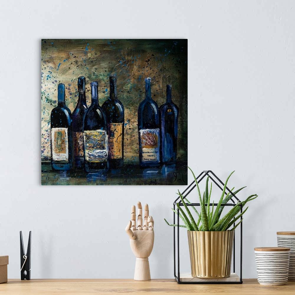 A bohemian room featuring Square painting of cool toned wine bottles with a blue paint splattered overlay.