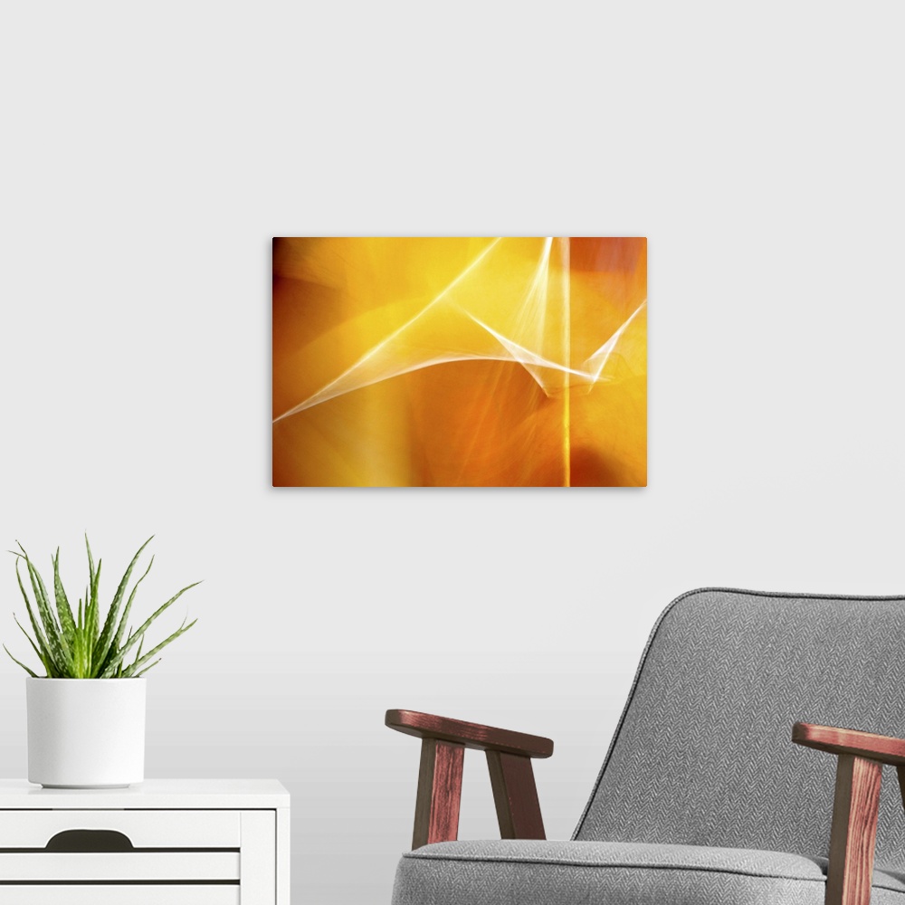 A modern room featuring Digital abstract art in bright shades of yellow and orange.