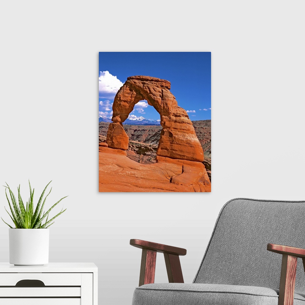 A modern room featuring Bright red natural arch on a cliff in Arches National Park, Utah.