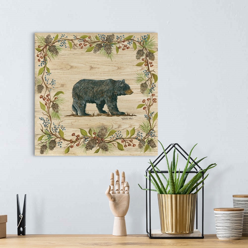 A bohemian room featuring Square decorative painting of a black bear on a wood grain background with a leafy frame with ber...