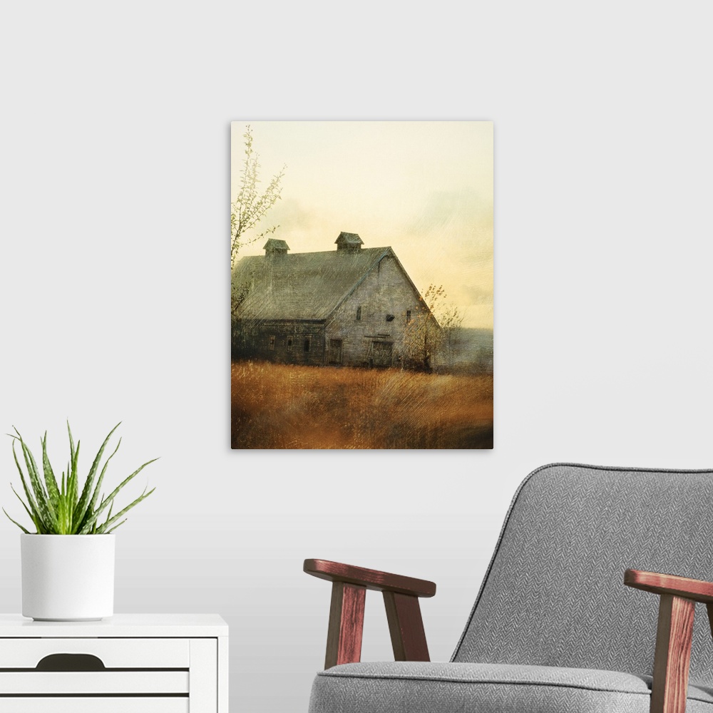 A modern room featuring Vertical painting on a big canvas of an old barn in a golden field at sunset. Painted with streak...