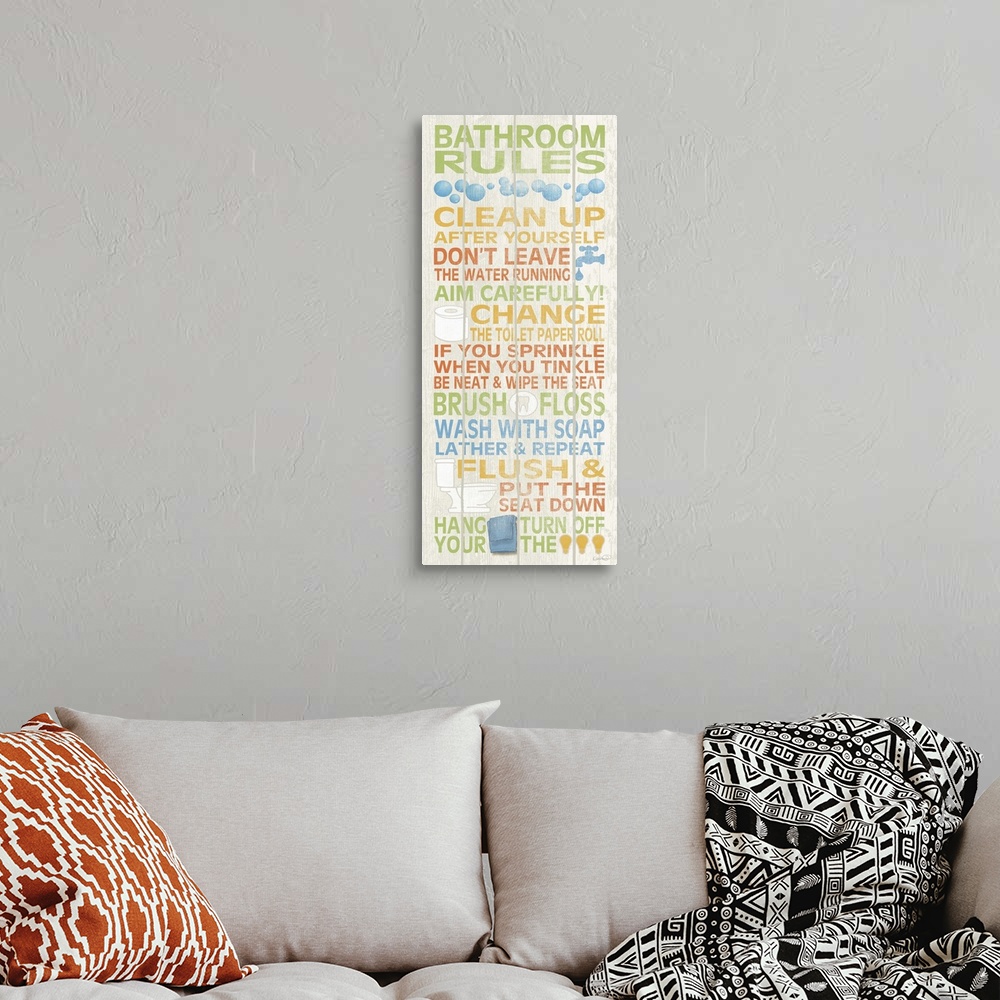 A bohemian room featuring A colorful list of bathroom rules on a tall wooden panel.