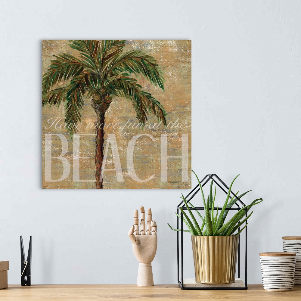 A bohemian room featuring Neutral toned square beach decor with a painting of a palm tree and "Have more fun at the Beach" ...